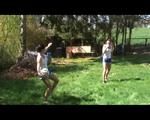 Jill and a friend of her playing soccer in the garden while wearing shiny nylon shorts (Video)