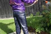 Watching sexy Sandra watering the flowers in the garden and lolling in the sun wearing a sexy blue shiny nylon rain pant and a purple down jacket (Pics)