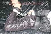 Sandra tied and gagged on a sofa with ropes and a clothgag wearing hot black downwear (Pics)