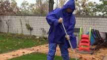 Watching sexy Pia wearing sexy blue shiny nylon rainwear and yellow rubber boots raking leaves (Video)