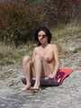 Naked sunbathing on a hill side