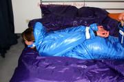 Alina tied and gagged in a shiny skisuit