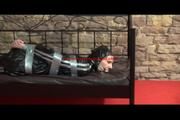 Mara tied with tape and gagged on a princess bed in an old cellar wearing an black sauna suit (Video)