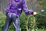 Watching sexy Sandra watering the flowers in the garden and lolling in the sun wearing a sexy blue shiny nylon rain pant and a purple down jacket (Pics)