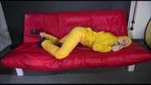 ***MARA*** ties and gagges with cuffs on the sofa wearing a supersexy oldschool yellow rain suit with hood (Video)