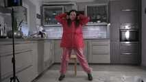 Miss Amira in red nylon rain gear and tranparent rain suit