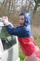 Jill tied and gagged outdoor on a car wearing a sexy red shiny nylon shorts and an oldschool rain jacket (Pics)