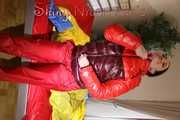 Watching sexy Jill wearing a sexy red shiny nylon rain pants and a red/ purple downjacket lolling in her bed (Pics)