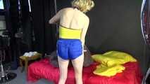 *** Sexy MIA wearing a blue shiny nylon shorts and a yellow top during changing the cloths on her bed  (Video)***