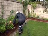 Watch Chloe gardening in her shiny nylon Rainwear