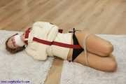 Hogtied in a straithjacket