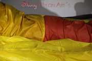 Watching Sandra wearing supersexy shiny nylon rainwear in yellow and orange preparing her bed and lolling in it with this shiny rainwear (Pics)