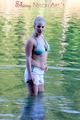 Jenny sunbathing on a lake and go swimming wearing sexy shiny nylon shorts and a bikini-top (Pics)