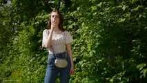 18 y.o. Sasha is smoking two white 120mm cigarettes outdoors