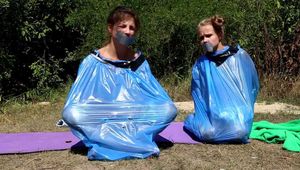 Dana & Ketrin  - Dana joins to her former captive, both are ball tied and trash bag packed (video)