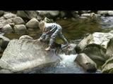 Sophie enjoying the water and weather on a river wearing supersexy grey sauna pvc rainwear (Video)