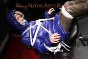 Sexy Sonja being tied and gagged on a stool with ropes and a clothgag wearing sexy shiny nylon dowmwear and a rain cape  (Pics)