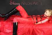 ***HOT***HOT***HOT***Mia wearing a sexy red shiny nylon jumpsuit and black shiny heel rubber boots being tied and gagged with belts and a clothgag (Pics)