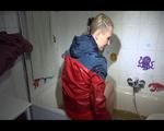 Mara wearing a sexy shiny nylon shorts and an odlschool rain jacket while taking a bath in mud (Video)