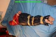 Get 46 Pictures with Yvette tied and gagged in shiny nylon rainwear from 2005-2008!
