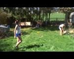 Jill and a friend of her playing soccer in the garden while wearing shiny nylon shorts (Video)