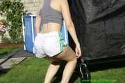 Watch Chloe enjoying her shiny nylon Shorts outside at a sunny Day