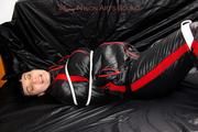 Jill bound and gagged in a shiny nylon skisuit