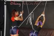 Watching sexy Stella and Sandra both wearing a hot shiny nylon shorts and a top being tied and gagged overhead with ropes and a ballgag (Pics)