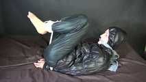 ***SEXY SONJA*** being tied and gagged on a bed with ropes and a clothgag wearing a sexy black shiny nylon down jacket and a black shiny nylon rain pants (Video)