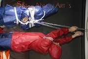 Watching sexy Sandra being tied and gagged overhead with ropes and a clothgag from Stella both wearing sexy shiny nylon AGU rainwear (Pics)