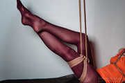 Hot suspended leg in red pantyhose