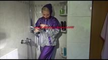 Mara wearing a sexy purple/silver pvc combination tied and gagged on a shower (Video)