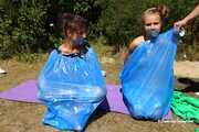 Dana & Ketrin  - Dana joins to her former captive, both are ball tied and trash bag packed
