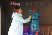 Watching sexy Stella and Sandra wearing a sexy shiny nylon shorts putting on several chiny nylon down jackets (Pics)