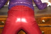 Alina tied and gagged on a commode wearing a shiny red/purple downwear combination (Pics)