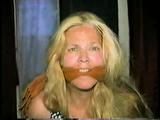 38 Yr OLD CASHIER IS CLEAVE GAGGED, HAS MOUTH STUFFED WITH STINKY NYLON STOCKINGS, DUCT TAPE GAGGED & BAREFOOT (D55-12)