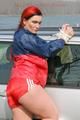 Jill tied and gagged outdoor on a car wearing a sexy red shiny nylon shorts and an oldschool rain jacket (Pics)