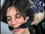 26 Yr OLD K-MART CLERK IS HANDGAGGED, MOUTH STUFFED, CLEAVE GAGGED TIT TIED, CROTCH ROPED PUSSY, OTM GAGGED WITH LEATHER STRAP, DROOLING, WHILE TIGHTLY TIED NAKED TO A CHAIR (D66-2)