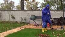 Watching sexy Pia wearing sexy blue shiny nylon rainwear and yellow rubber boots raking leaves (Video)