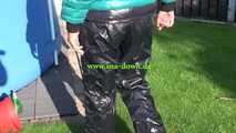 Watch Sandra in her shiny nylon Downwear outside in the Sun 