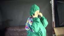 Watching sexy Sandra putting on three rainwear combinations one over the other, hooded (Video)