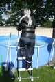 Watch Chloe enjoying the Summer in the Garden her shiny nylon Downjacket