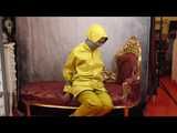 Miss Scarlett in layers of nylon raingear, a friesennerz and hard bound and gagged