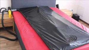 Play with slave girl in a vacuum bed