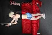 Watching ***NEW MODELL COURTNEY*** wearing a sexy lightblue shiny nylon shorts and a black top being tied and gagged overhead with ropes and a ballgag (Pics)