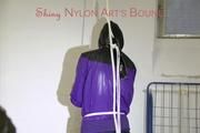 Mara tied and gagged in a cellar wearing sexy shiny nylon rainwear (Pics)