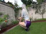 Get a video with Chloe enjoying gardening in her shiny nylon Shorts