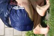Sexy Sandra wearing a sexy darkblue shiny nylon shorts and a blue downvest during her gardening work (Pics)