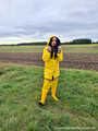 Miss Amira on the road in a Frisian mink, yellow rain dungarees and rubber boots