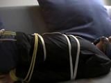 Two videos with one of our archive girls bound and gagged in shiny nylon shorts